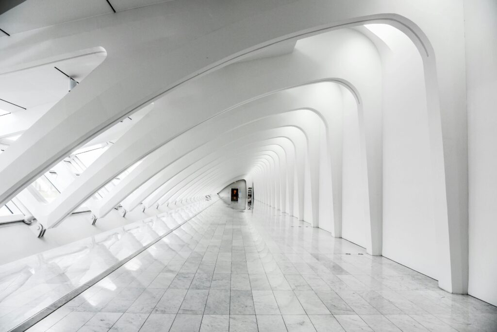 Explore the sweeping modern arches and minimalistic design of the Milwaukee Art Museum's white hallway.